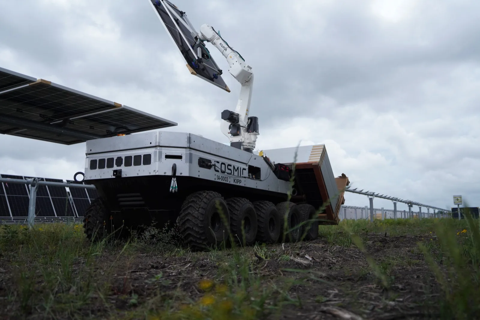 A robot arm installing a solar panel